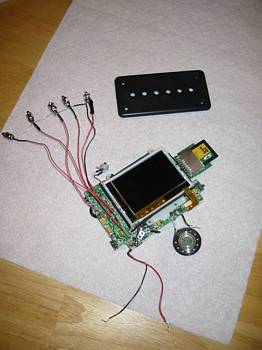 Circuit board with replacement switches (note the SD card on the adapter card), switch plate